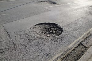 pothole in asphalt pavement