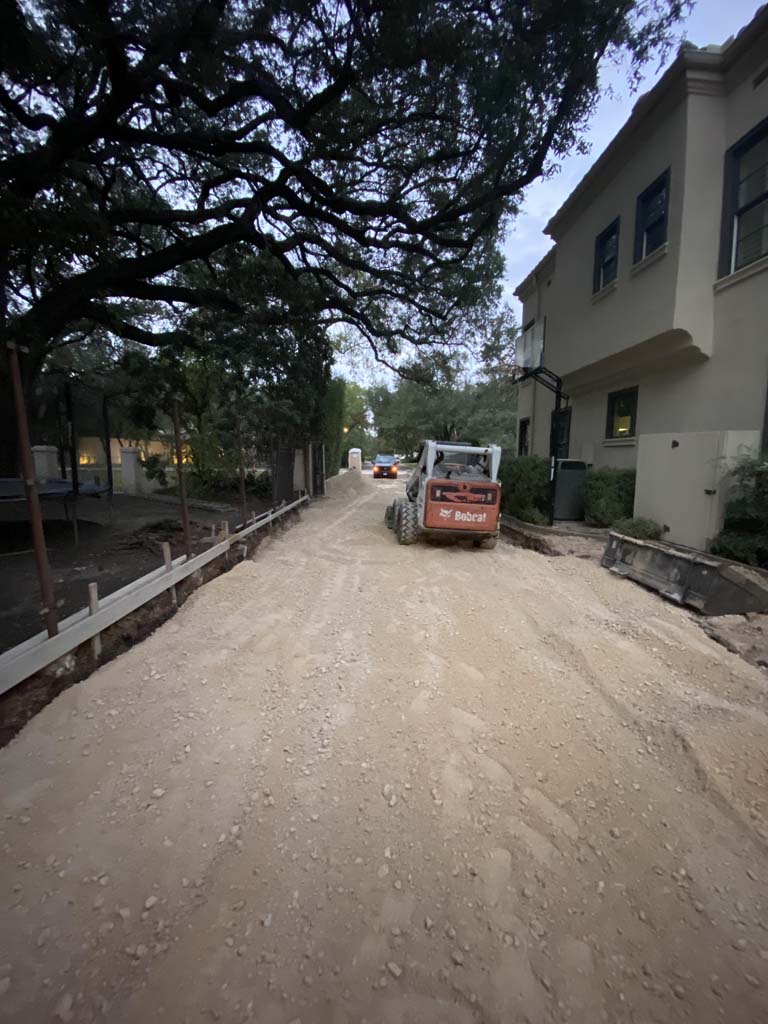 Image of base material being spread through the driveway