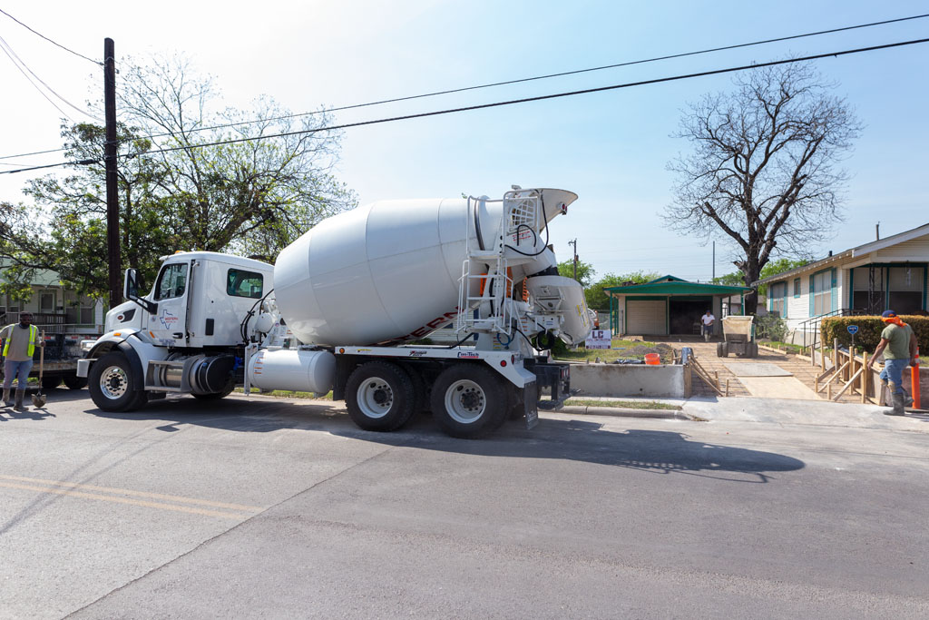Image of a concrete truck that arrived at a concrete driveway ready to be poured